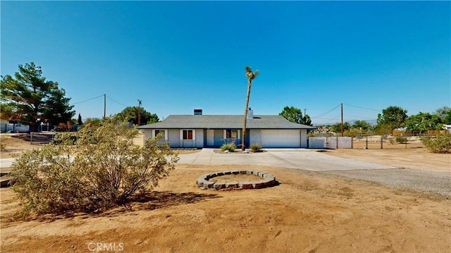 19171 Carlisle Rd, Apple Valley, CA 92307 - ranch-style home with concrete driveway and a garage