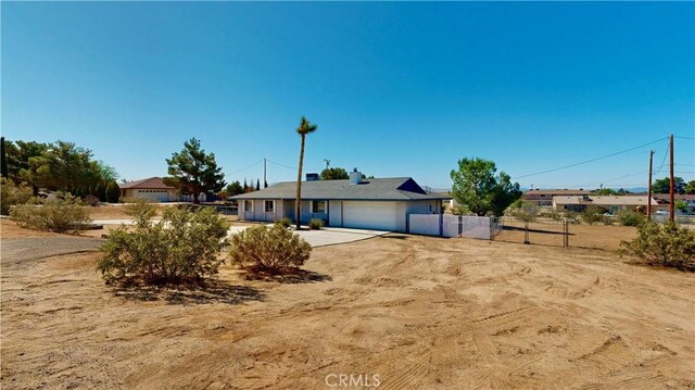 19171 Carlisle Rd, Apple Valley, CA 92307 - view of front of home featuring an attached garage and driveway