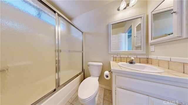 19171 Carlisle Rd, Apple Valley, CA 92307 - bathroom featuring vanity, enclosed tub / shower combo, and tile patterned floors