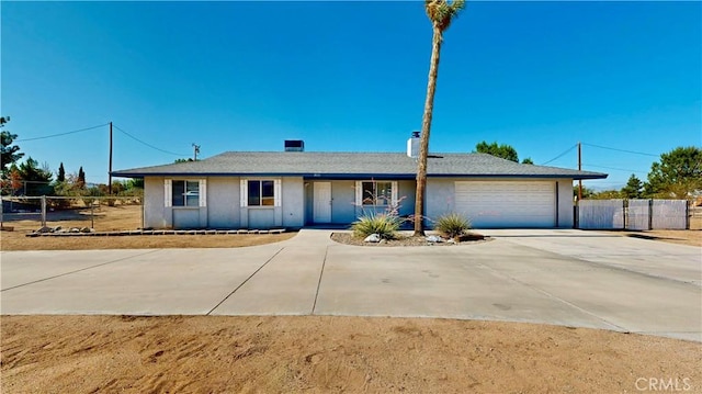 19171 Carlisle Rd, Apple Valley, CA 92307 - ranch-style home featuring concrete driveway, an attached garage, and stucco siding
