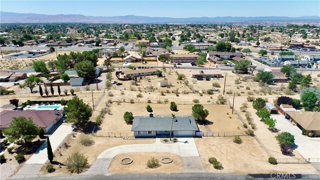 19171 Carlisle Rd, Apple Valley, CA 92307 - aerial perspective of suburban area with a mountainous background