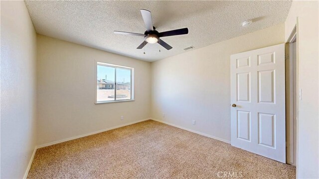 19171 Carlisle Rd, Apple Valley, CA 92307 - carpeted empty room with a ceiling fan, a textured ceiling, and a smoke detector