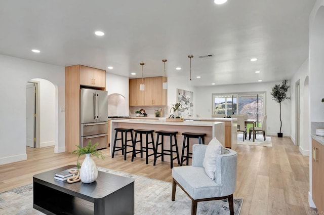 1665 Yale St, Chula Vista, CA 91913 - living area featuring arched walkways, light wood-type flooring, and recessed lighting