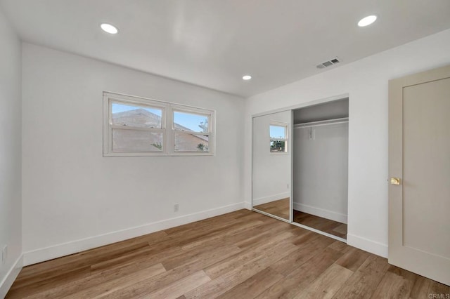 1665 Yale St, Chula Vista, CA 91913 - unfurnished bedroom featuring multiple windows, recessed lighting, light wood finished floors, and a closet