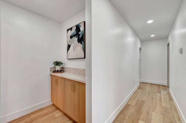 1665 Yale St, Chula Vista, CA 91913 - hallway with arched walkways, light wood-style flooring, and recessed lighting