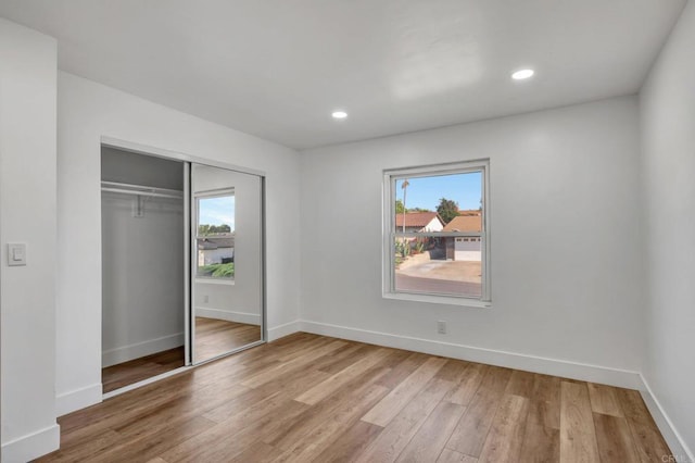 1665 Yale St, Chula Vista, CA 91913 - unfurnished bedroom with multiple windows, light wood finished floors, a closet, and recessed lighting