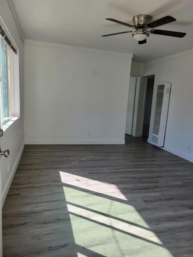 3222 42nd St, San Diego, CA 92105 - unfurnished room with a heating unit, ceiling fan, crown molding, and dark wood finished floors