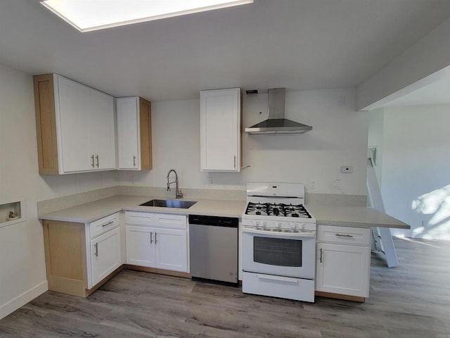 3222 42nd St, San Diego, CA 92105 - kitchen with wall chimney range hood, gas range gas stove, stainless steel dishwasher, and light wood finished floors