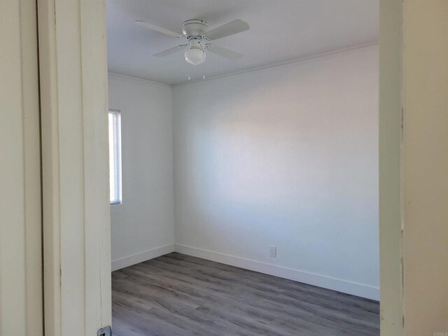 3222 42nd St, San Diego, CA 92105 - spare room with dark wood finished floors, a ceiling fan, and crown molding