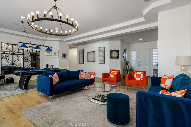 43875 Spiaggia Pl, Indio, CA 92203 - living area featuring a tray ceiling, wood finished floors, a chandelier, and pool table