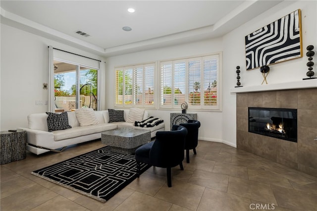 43875 Spiaggia Pl, Indio, CA 92203 - living room featuring a fireplace and a raised ceiling