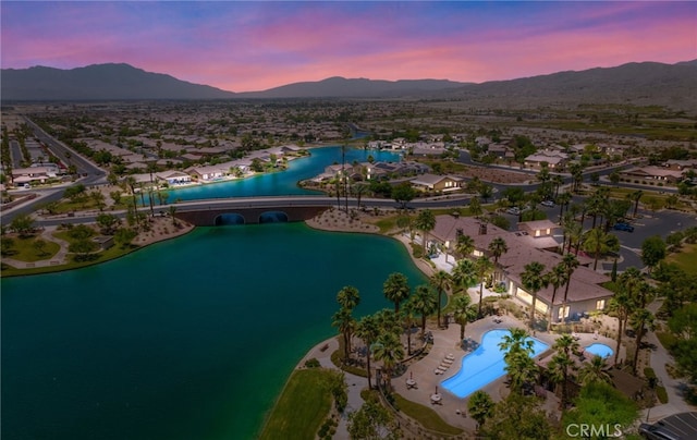 43875 Spiaggia Pl, Indio, CA 92203 - aerial view at dusk of a water and mountain view, view of pool, and a residential view