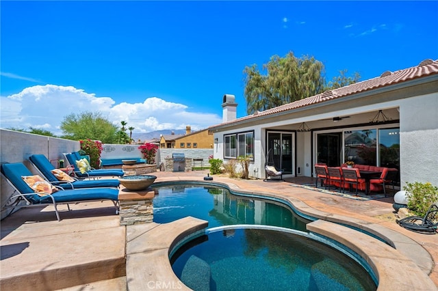 43875 Spiaggia Pl, Indio, CA 92203 - view of pool with a patio area, a pool with connected hot tub, outdoor lounge area, and grilling area