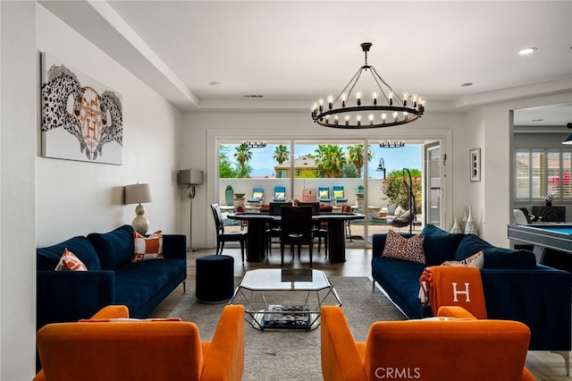 43875 Spiaggia Pl, Indio, CA 92203 - living room with a chandelier, plenty of natural light, and wood finished floors