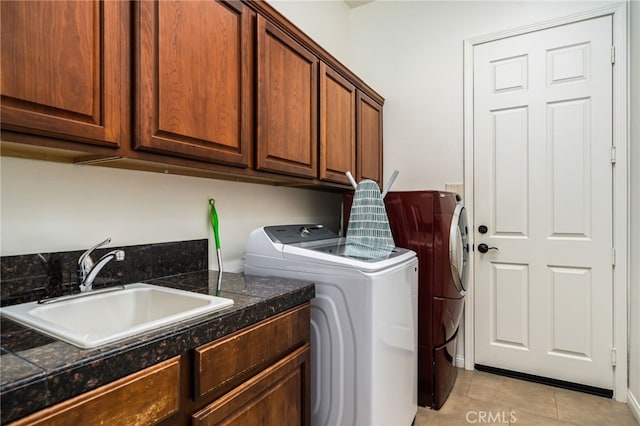43875 Spiaggia Pl, Indio, CA 92203 - washroom featuring cabinet space, washer and clothes dryer, and light tile patterned flooring