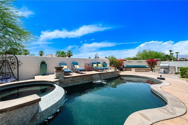 43875 Spiaggia Pl, Indio, CA 92203 - view of pool featuring a patio area, a pool with connected hot tub, and grilling area