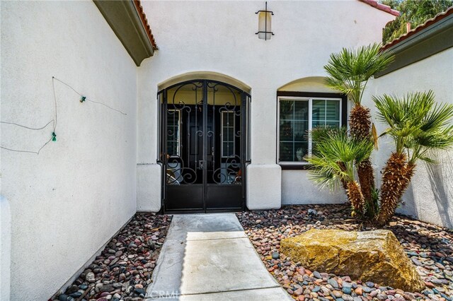 43875 Spiaggia Pl, Indio, CA 92203 - entrance to property featuring french doors and stucco siding