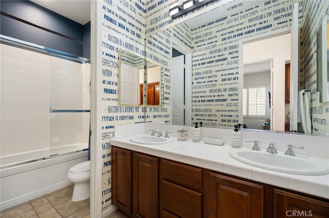 43875 Spiaggia Pl, Indio, CA 92203 - full bath with double vanity, combined bath / shower with glass door, and wallpapered walls