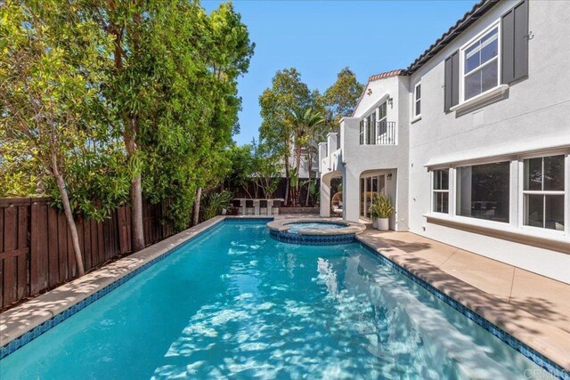 7147 Sitio Bahia, Carlsbad, CA 92009 - view of pool featuring a fenced backyard, a pool with connected hot tub, and a patio