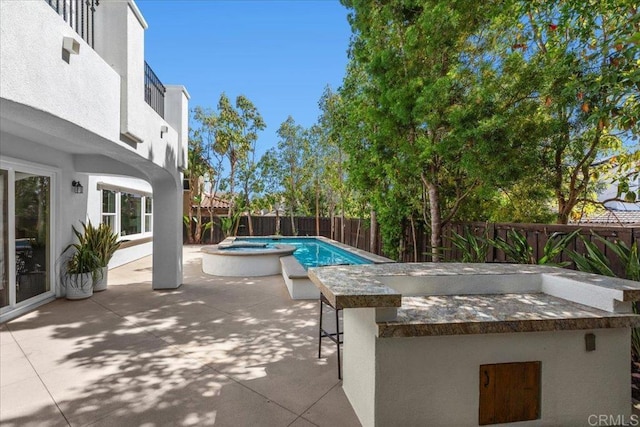7147 Sitio Bahia, Carlsbad, CA 92009 - fenced backyard featuring a patio and a pool with connected hot tub