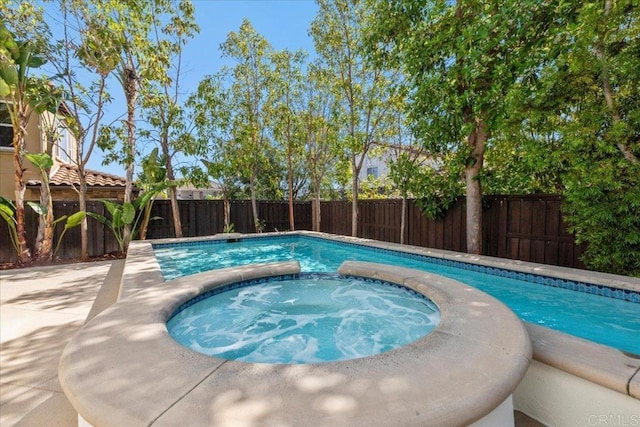 7147 Sitio Bahia, Carlsbad, CA 92009 - view of pool with a fenced backyard and a pool with connected hot tub