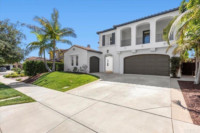 7147 Sitio Bahia, Carlsbad, CA 92009 - mediterranean / spanish-style home featuring a balcony, an attached garage, stucco siding, and a tiled roof