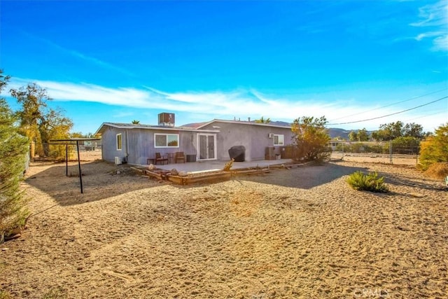 7227 Sherman Hoyt Ave Unit 29, Palms, CA 92277 - rear view of house with a patio and stucco siding