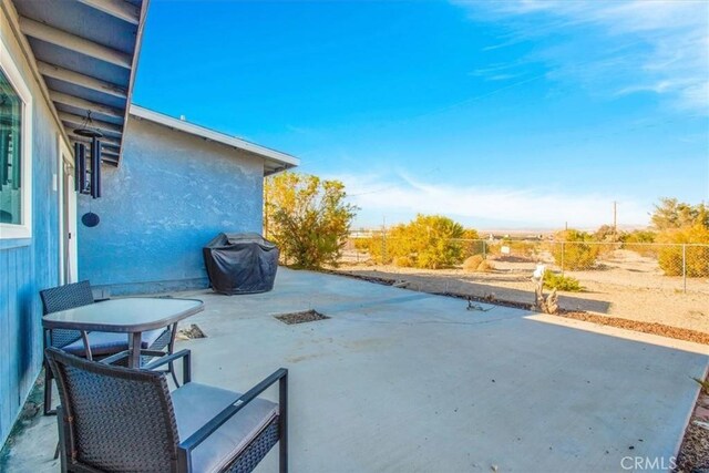 7227 Sherman Hoyt Ave Unit 29, Palms, CA 92277 - fenced backyard with a patio and area for grilling