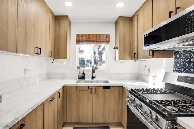 7227 Sherman Hoyt Ave Unit 29, Palms, CA 92277 - kitchen with stainless steel appliances, light stone counters, and recessed lighting