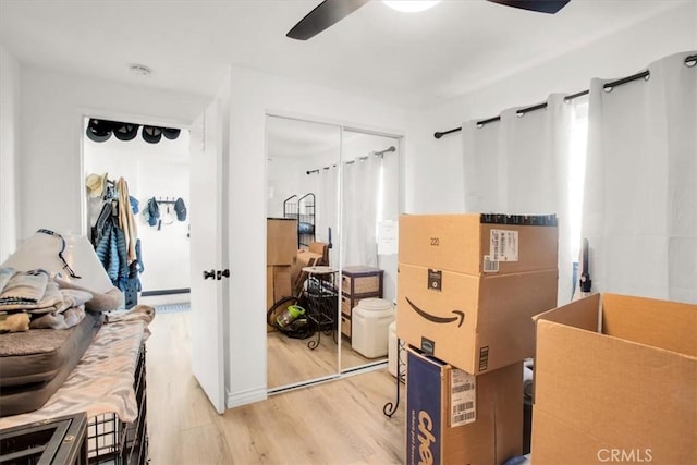 7227 Sherman Hoyt Ave Unit 29, Palms, CA 92277 - bedroom with light wood finished floors, a closet, and ceiling fan