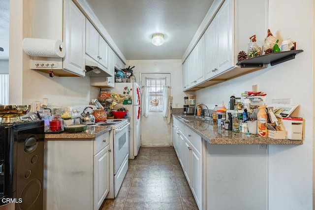 656 W Hemlock St, Port Hueneme, CA 93041 - kitchen featuring white electric stove and white cabinets