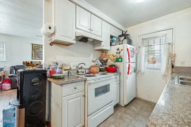 656 W Hemlock St, Port Hueneme, CA 93041 - kitchen featuring white appliances, under cabinet range hood, white cabinetry, and light countertops