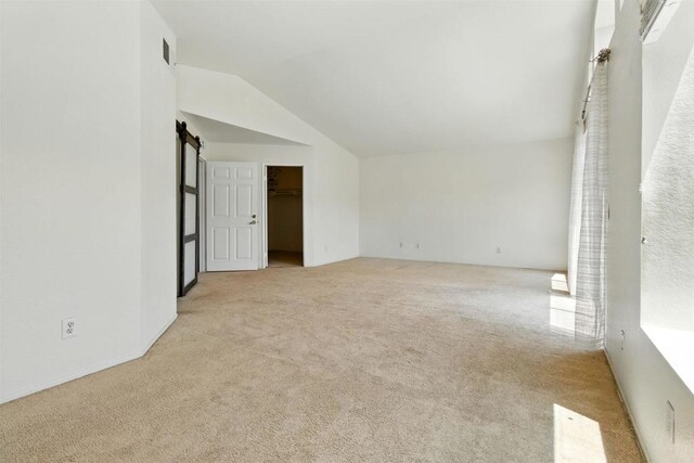 2344 Greenbriar Dr Unit A, Chula Vista, CA 91915 - carpeted empty room with vaulted ceiling and a barn door