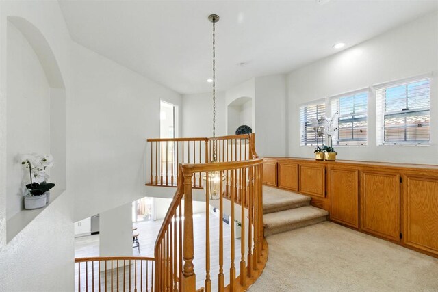2344 Greenbriar Dr Unit A, Chula Vista, CA 91915 - staircase featuring healthy amount of natural light, carpet floors, arched walkways, and recessed lighting