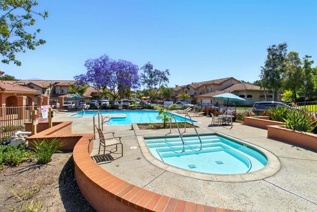 2344 Greenbriar Dr Unit A, Chula Vista, CA 91915 - community pool featuring a community hot tub, a patio area, and a residential view