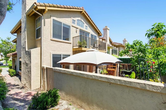 2344 Greenbriar Dr Unit A, Chula Vista, CA 91915 - rear view of house with a balcony and stucco siding