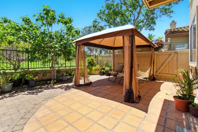 2344 Greenbriar Dr Unit A, Chula Vista, CA 91915 - fenced backyard featuring a gazebo, a patio, and a gate