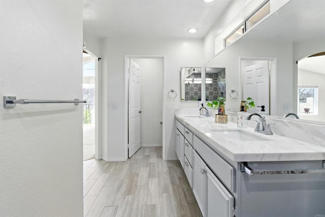 2344 Greenbriar Dr Unit A, Chula Vista, CA 91915 - full bathroom with double vanity, recessed lighting, and wood finished floors