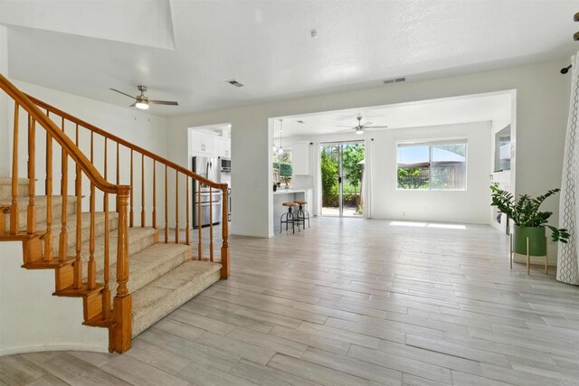 2344 Greenbriar Dr Unit A, Chula Vista, CA 91915 - staircase with ceiling fan and wood finished floors