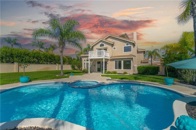 30528 Covecrest Cir, Menifee, CA 92584 - pool at dusk with a pool with connected hot tub and a patio area