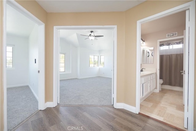 30528 Covecrest Cir, Menifee, CA 92584 - hallway featuring carpet floors and wood finished floors