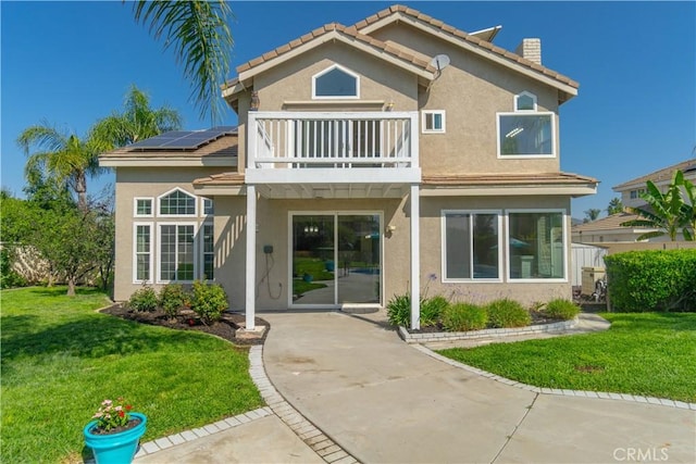 30528 Covecrest Cir, Menifee, CA 92584 - view of front of property featuring a balcony, a chimney, stucco siding, and a front lawn
