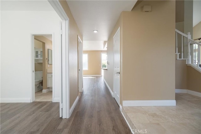 30528 Covecrest Cir, Menifee, CA 92584 - corridor featuring stairs and wood finished floors