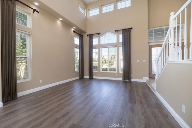 30528 Covecrest Cir, Menifee, CA 92584 - entrance foyer with stairway, dark wood finished floors, a high ceiling, and healthy amount of natural light