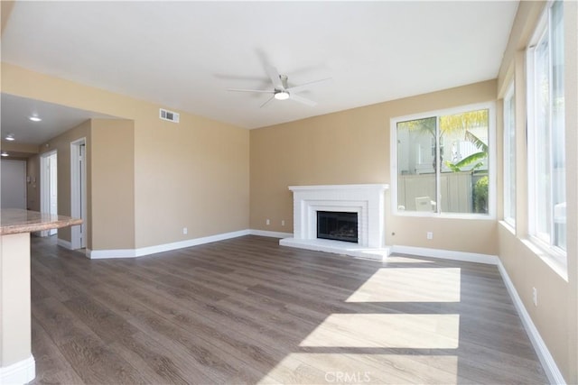 30528 Covecrest Cir, Menifee, CA 92584 - unfurnished living room featuring ceiling fan, wood finished floors, and a brick fireplace