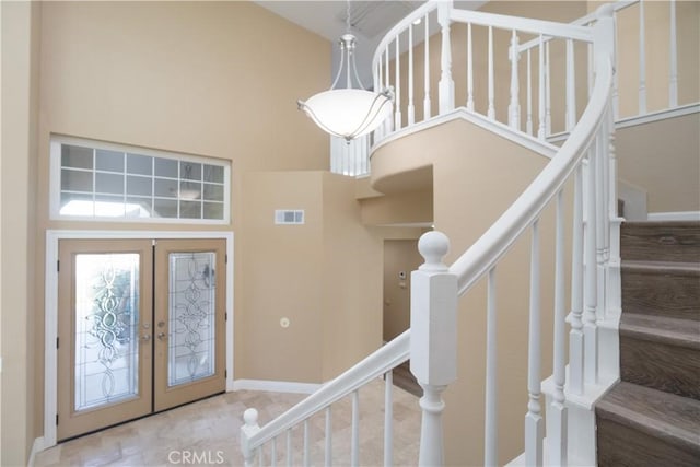 30528 Covecrest Cir, Menifee, CA 92584 - entryway with french doors, a high ceiling, and stairs