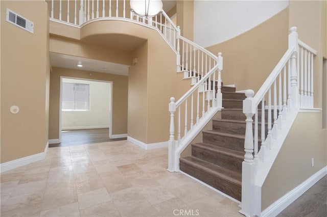 30528 Covecrest Cir, Menifee, CA 92584 - staircase featuring a high ceiling and baseboards