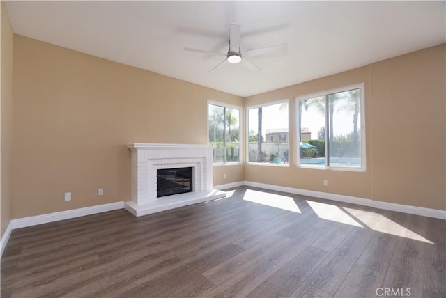 30528 Covecrest Cir, Menifee, CA 92584 - unfurnished living room featuring wood finished floors, a ceiling fan, and a brick fireplace