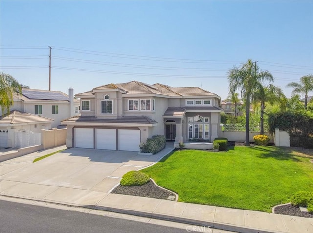 30528 Covecrest Cir, Menifee, CA 92584 - mediterranean / spanish-style house with an attached garage, stucco siding, concrete driveway, and a tiled roof