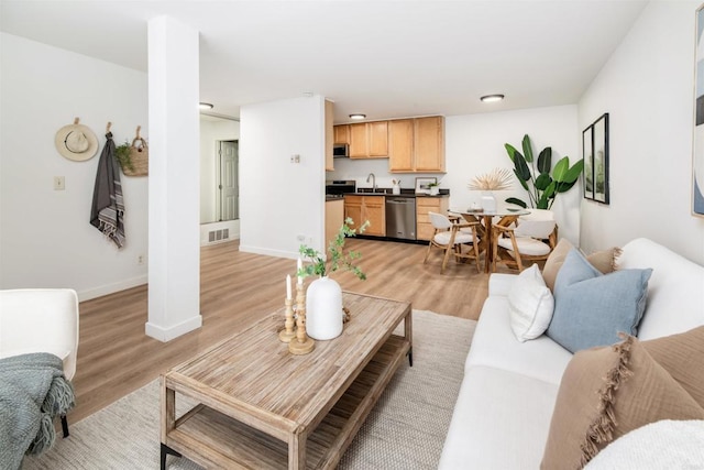 13754 Mango Dr Unit 111, Del Mar, CA 92014 - living area with light wood finished floors